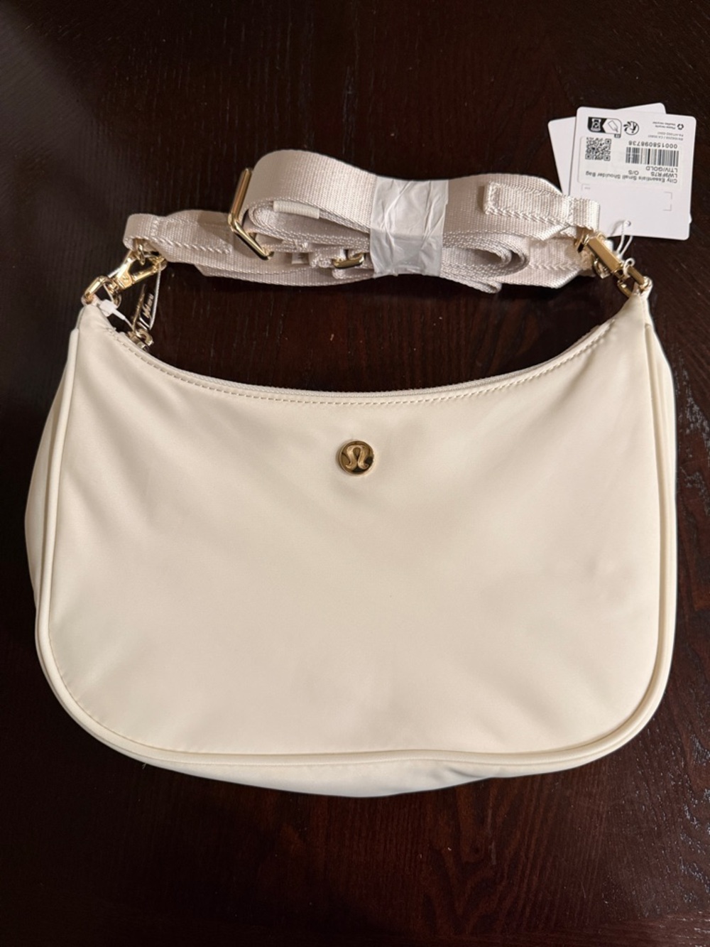 lululemon city essential small shoulder bag. 3L. light ivory/gold. NWT.